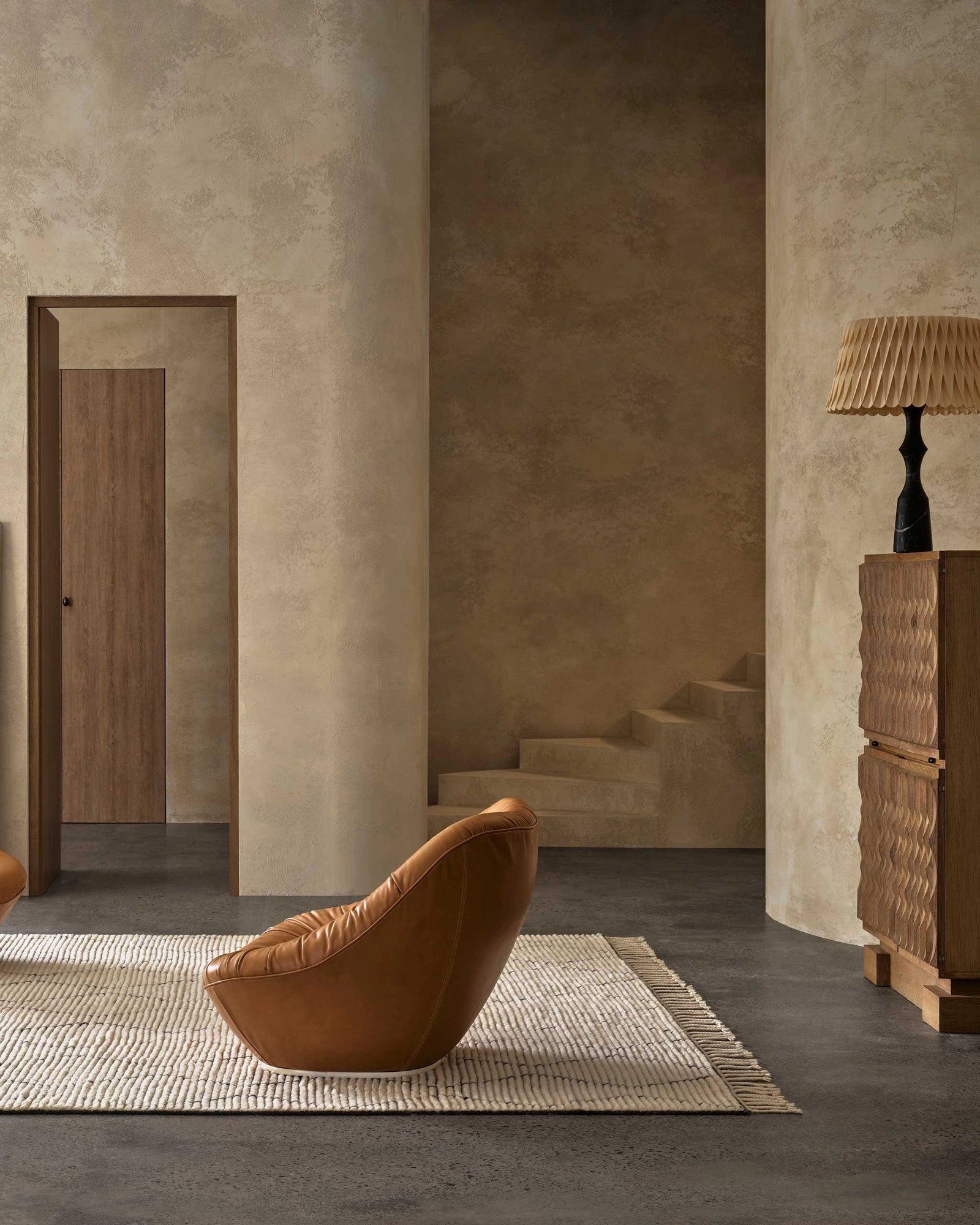 Handwoven wool rug with geometric diamond pattern in natural and slate tones and zigzag design